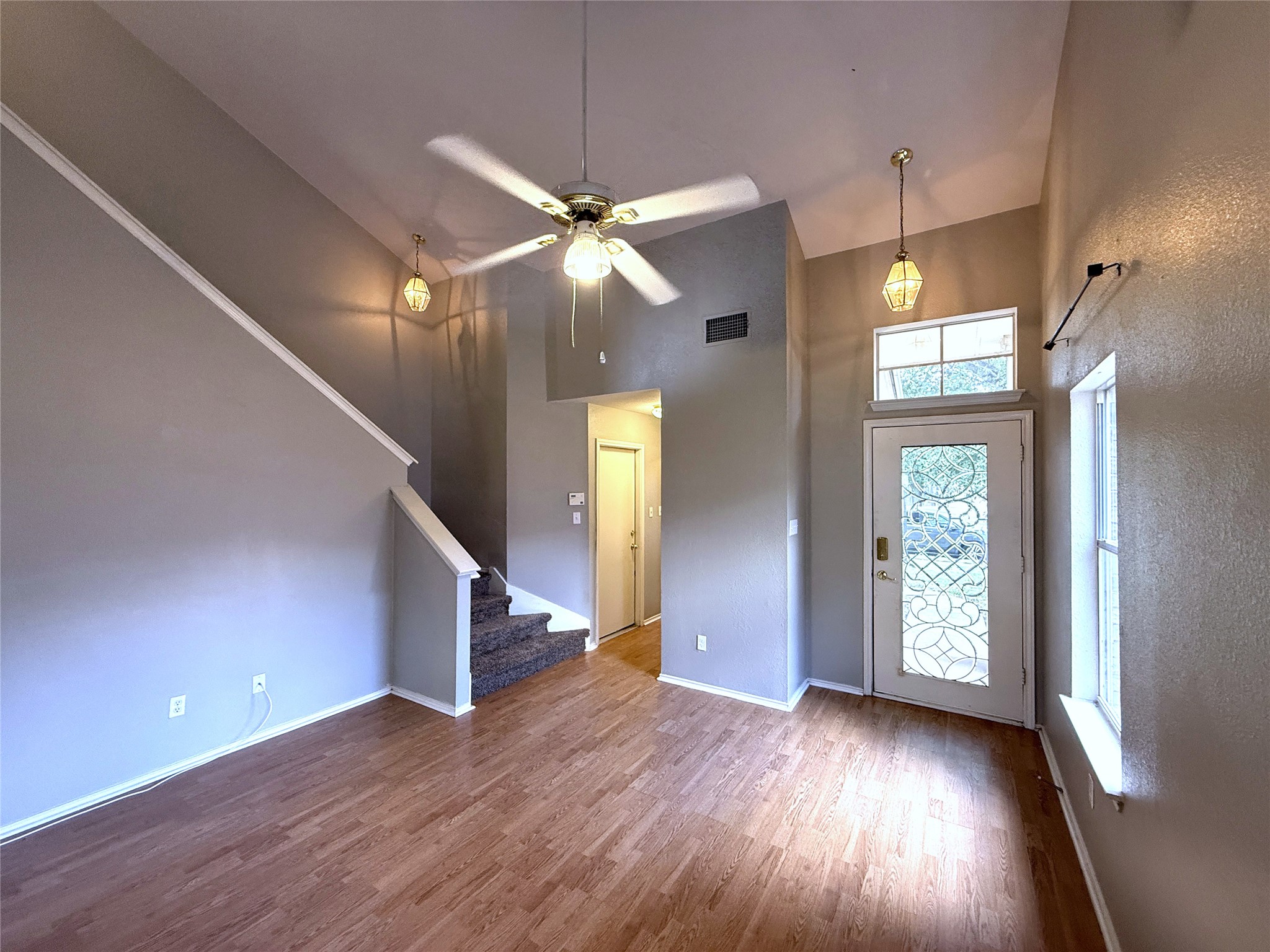 2120 Jester Farms Road Round Rock, TX 78664 - Photo 5 of 28 A welcoming entry features vaulted ceilings and a unique front door with decorative glass.