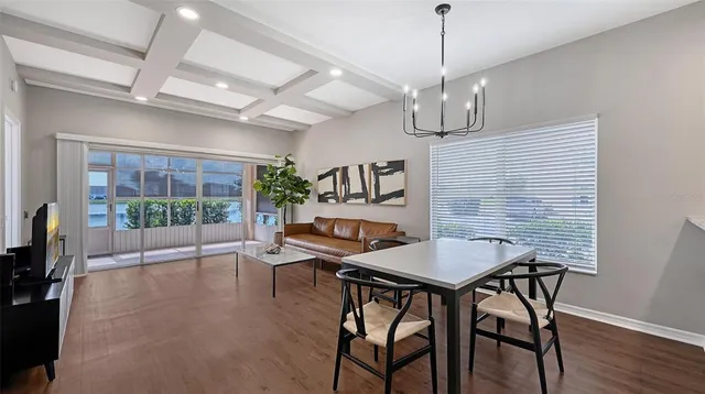a kitchen with granite countertop sink and refrigerator
