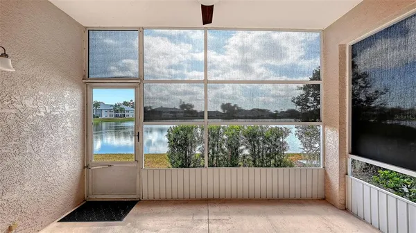 a kitchen with granite countertop stainless steel appliances white cabinets granite counter tops and a wooden floors