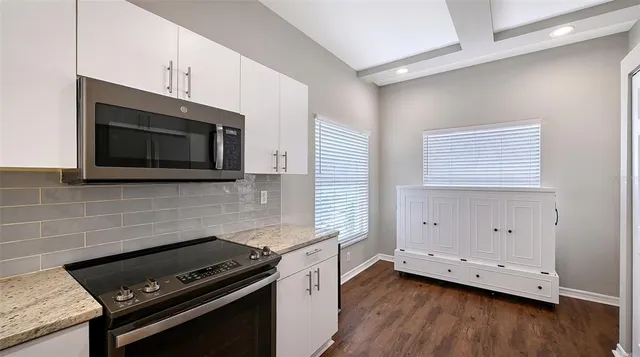 a bathroom with a glass shower door and a shower