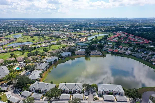 an aerial view of city and lake
