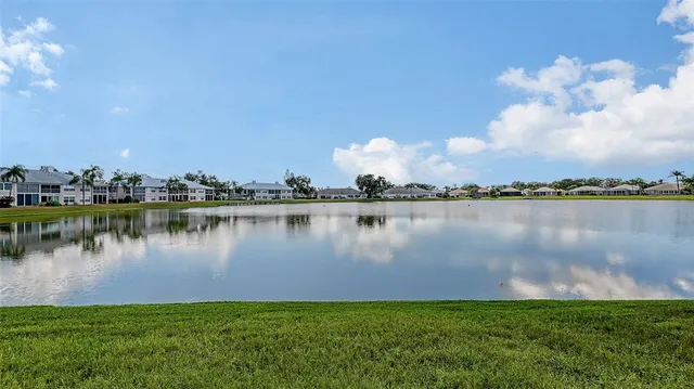an aerial view of a house with garden space and street view