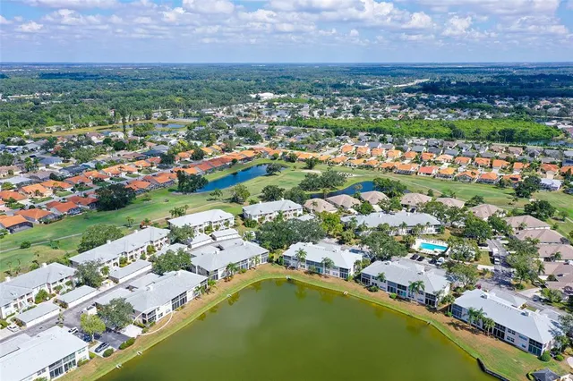 a patio with a table and chairs under an umbrella