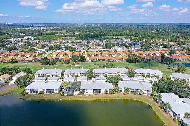 a view of a house with swimming pool and a yard