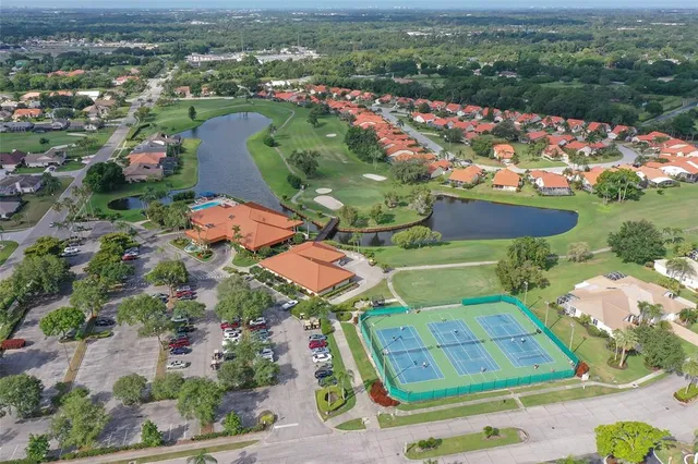 a living room with lots of furniture and a floor to ceiling window