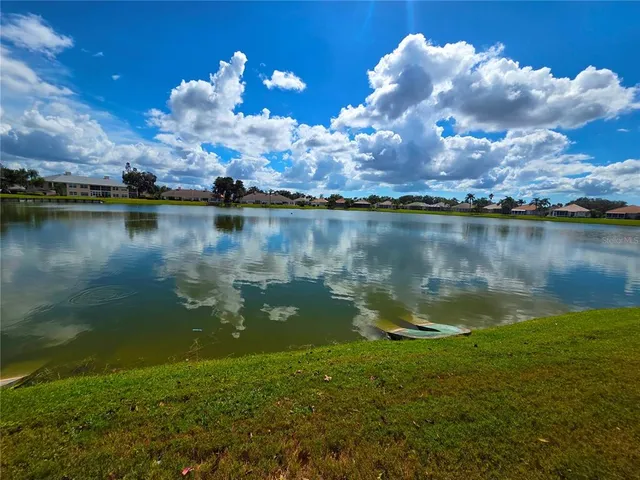an aerial view of a house with a lake view