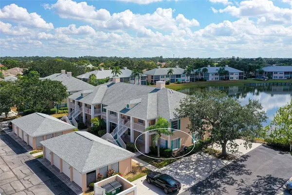 an aerial view of a house with lake view
