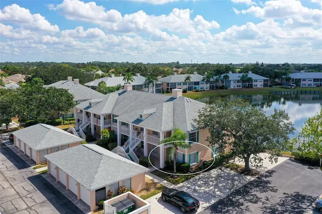 an aerial view of a house with lake view