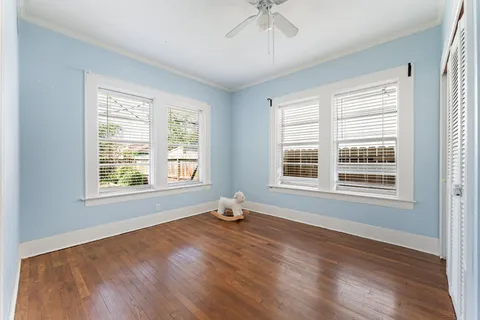 a room with a window and wooden floor