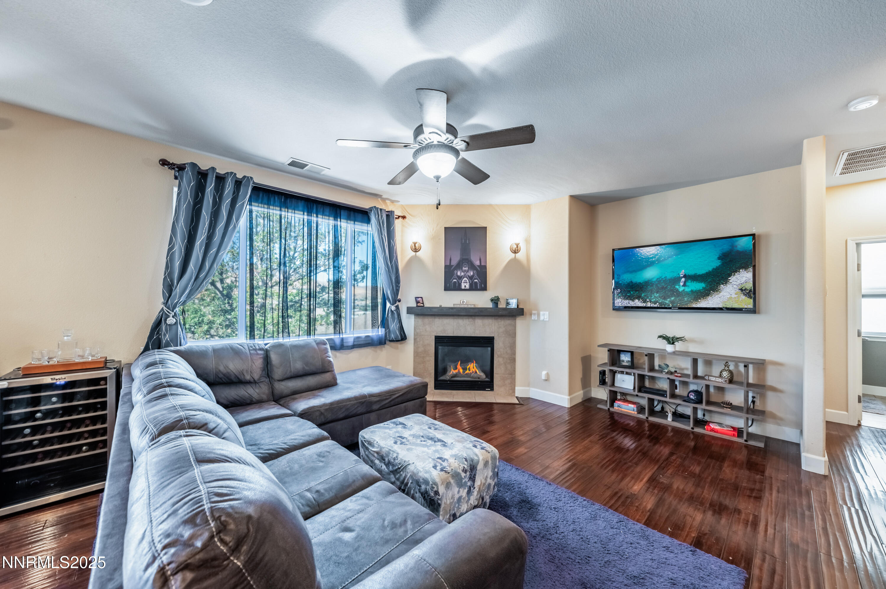 3715 Coastal Street Reno, NV 89512 - Photo 11 of 35 a living room with fireplace furniture and a flat screen tv