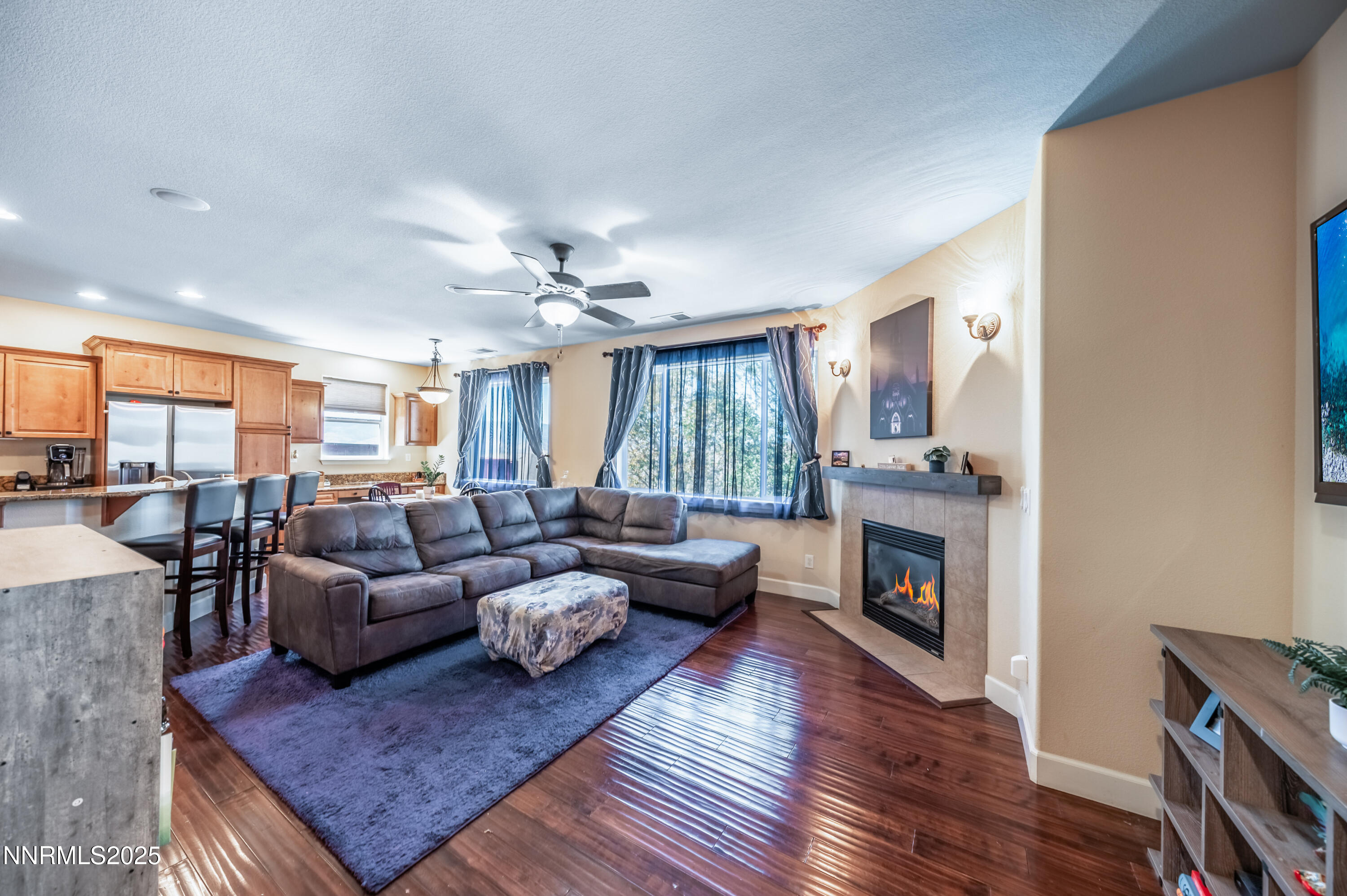 3715 Coastal Street Reno, NV 89512 - Photo 12 of 35 a living room with furniture and a fireplace