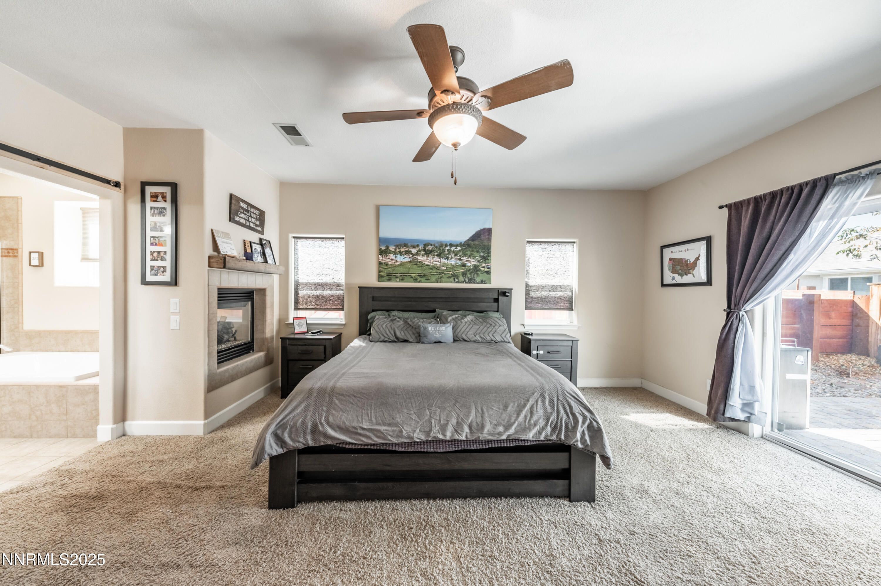 3715 Coastal Street Reno, NV 89512 - Photo 13 of 35 a spacious bedroom with a bed and a large window