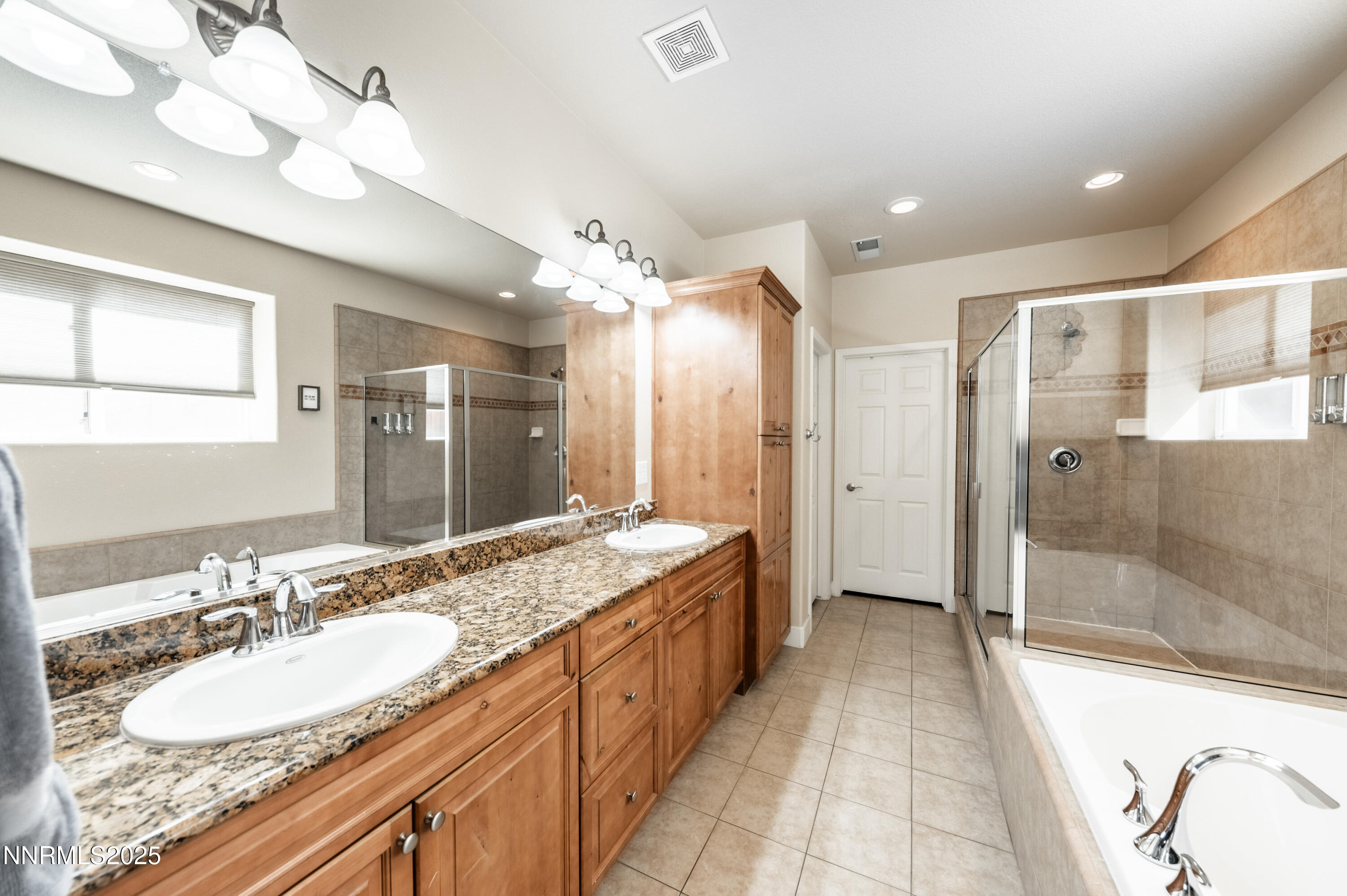 3715 Coastal Street Reno, NV 89512 - Photo 15 of 35 a spacious bathroom with a double vanity sink mirror and shower