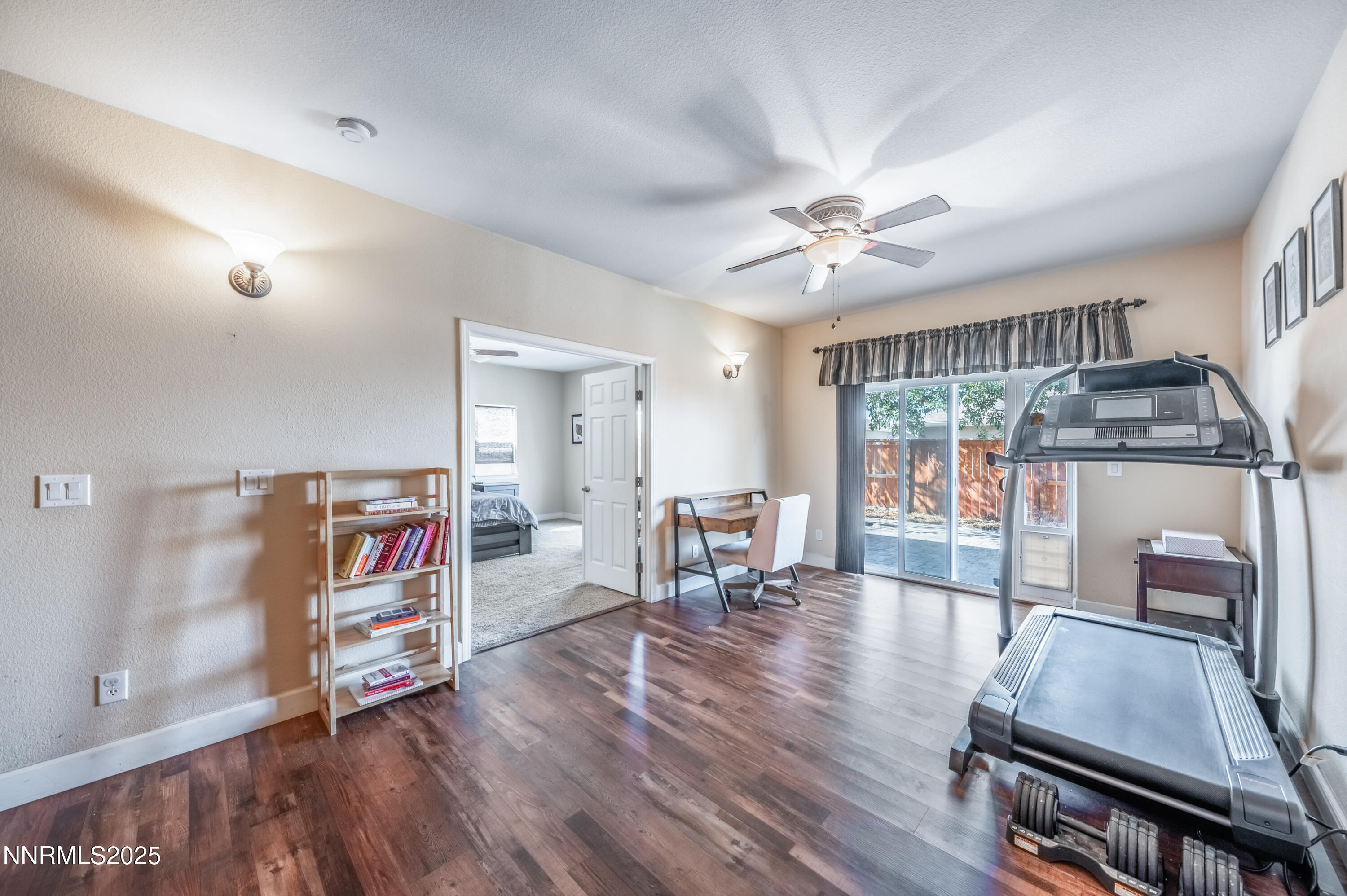 3715 Coastal Street Reno, NV 89512 - Photo 20 of 35 a living room with furniture and a flat screen tv