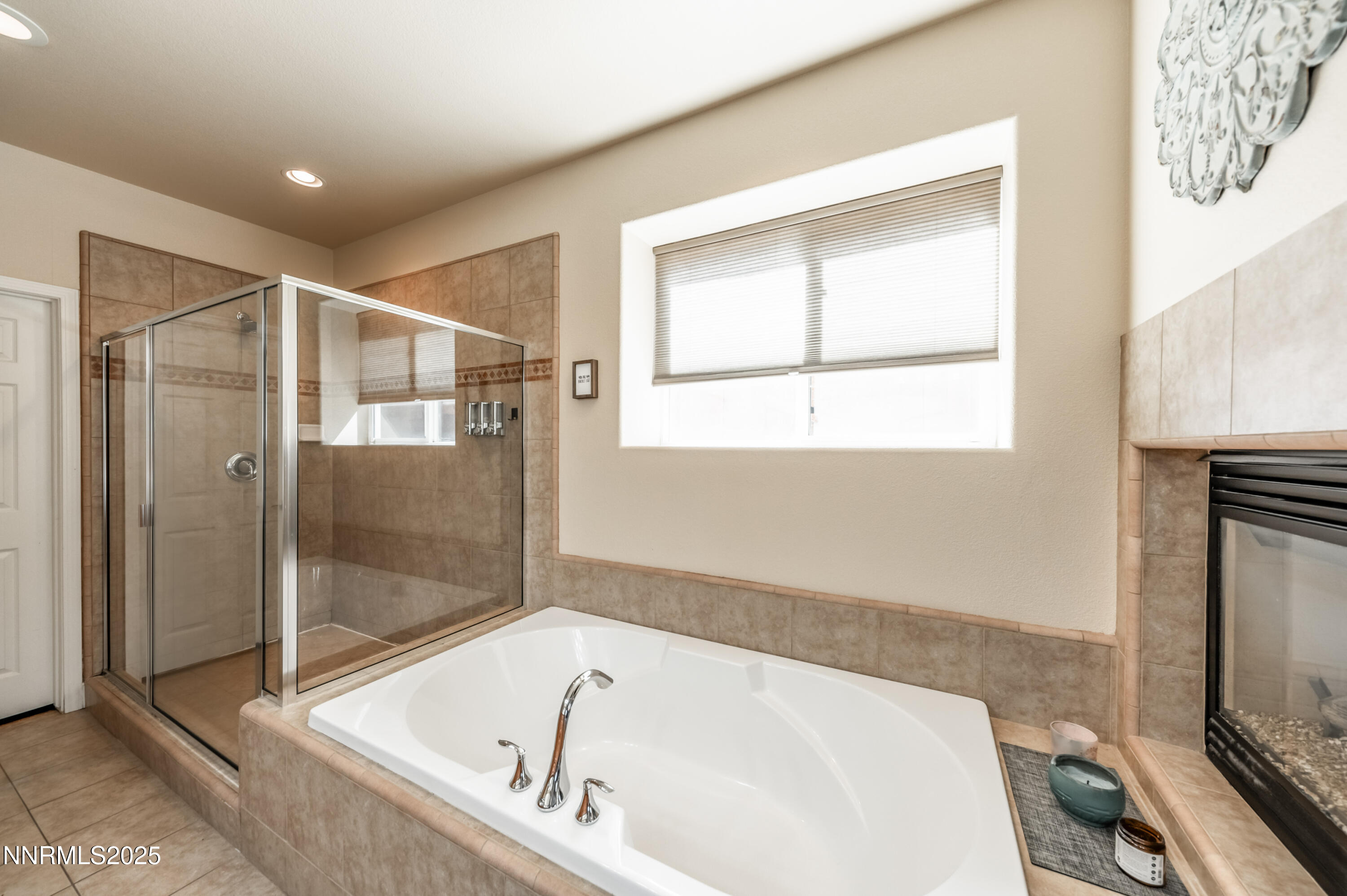 3715 Coastal Street Reno, NV 89512 - Photo 23 of 35 a bathroom with a tub and a shower