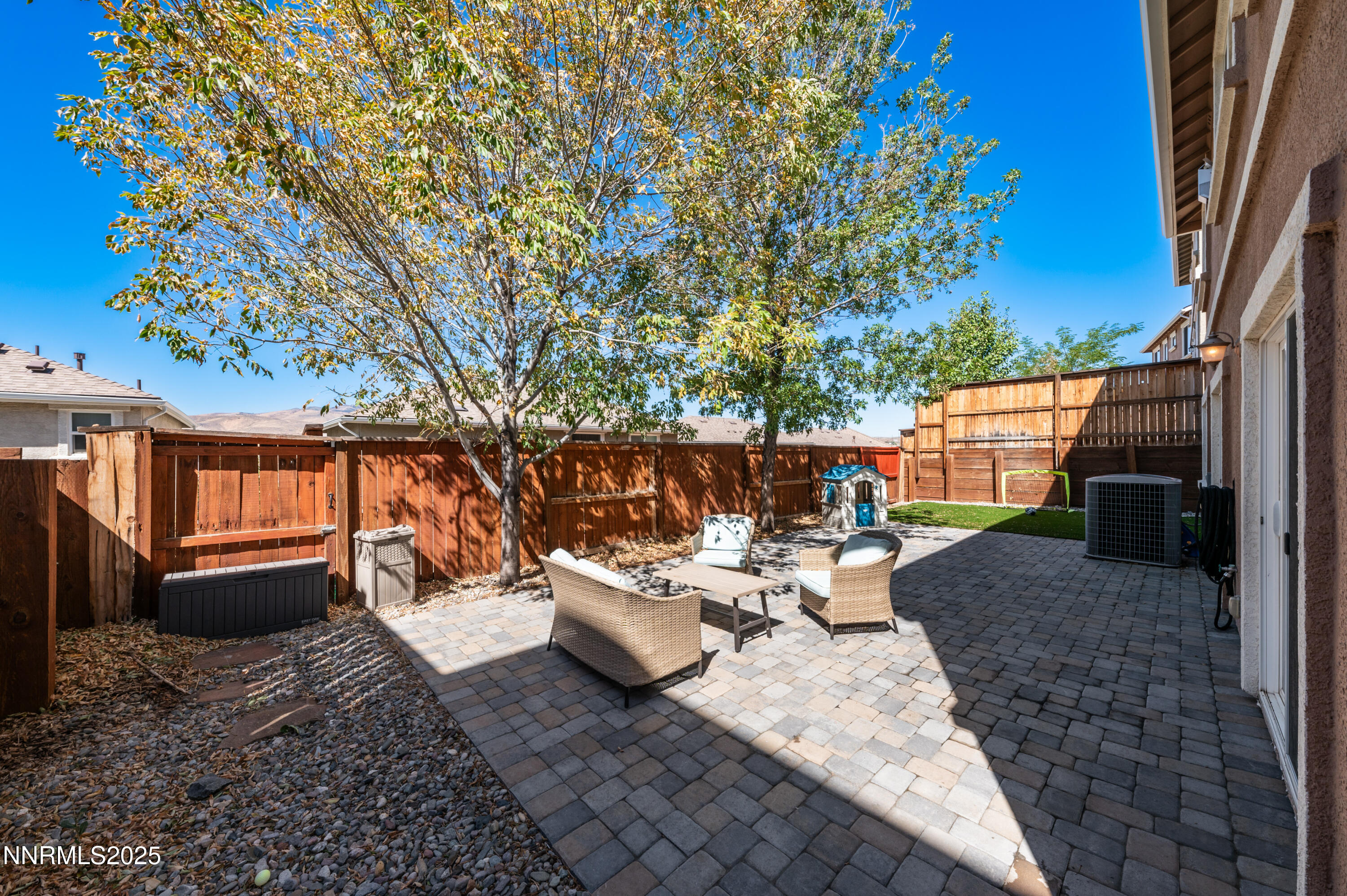 3715 Coastal Street Reno, NV 89512 - Photo 31 of 35 a backyard of a house with barbeque oven table and chairs