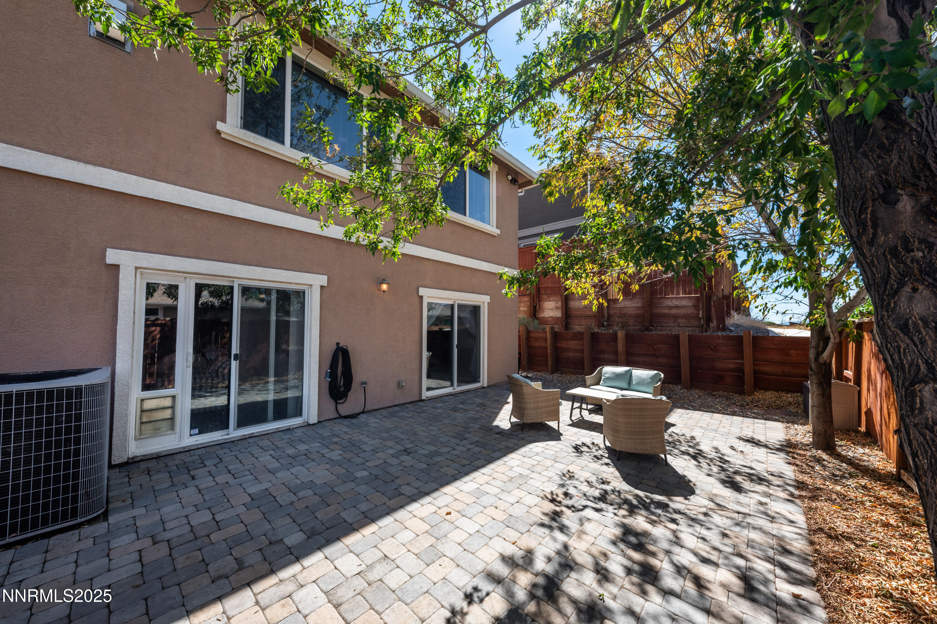 3715 Coastal Street Reno, NV 89512 - Photo 34 of 35 a backyard of a house with fire pit and outdoor seating