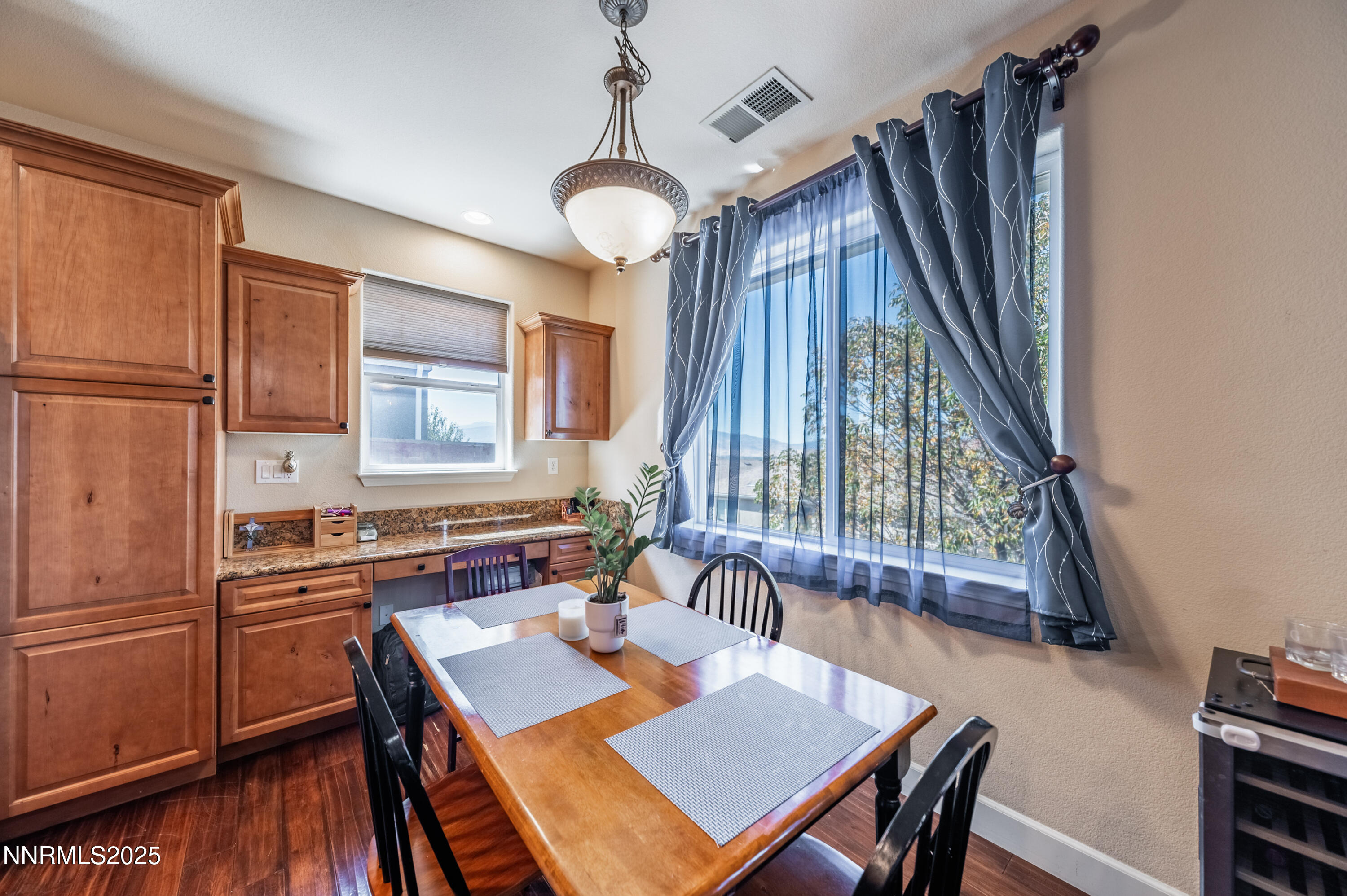 3715 Coastal Street Reno, NV 89512 - Photo 9 of 35 a view of a dining room with furniture window and wooden floor