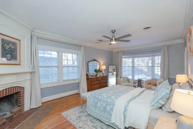 a bedroom with a large bed and a large window