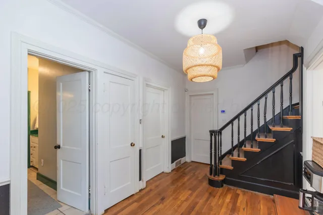 a view of entryway with wooden floor