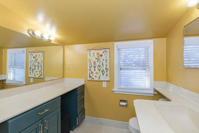 a bathroom with a sink a mirror and a bathtub