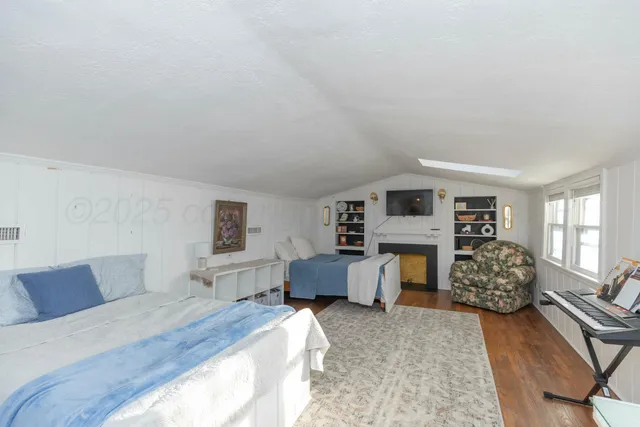 a spacious bedroom with a bed and furniture