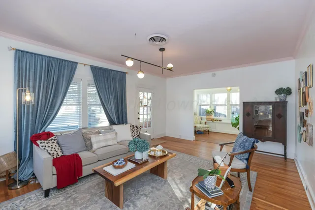 a living room with furniture and a window