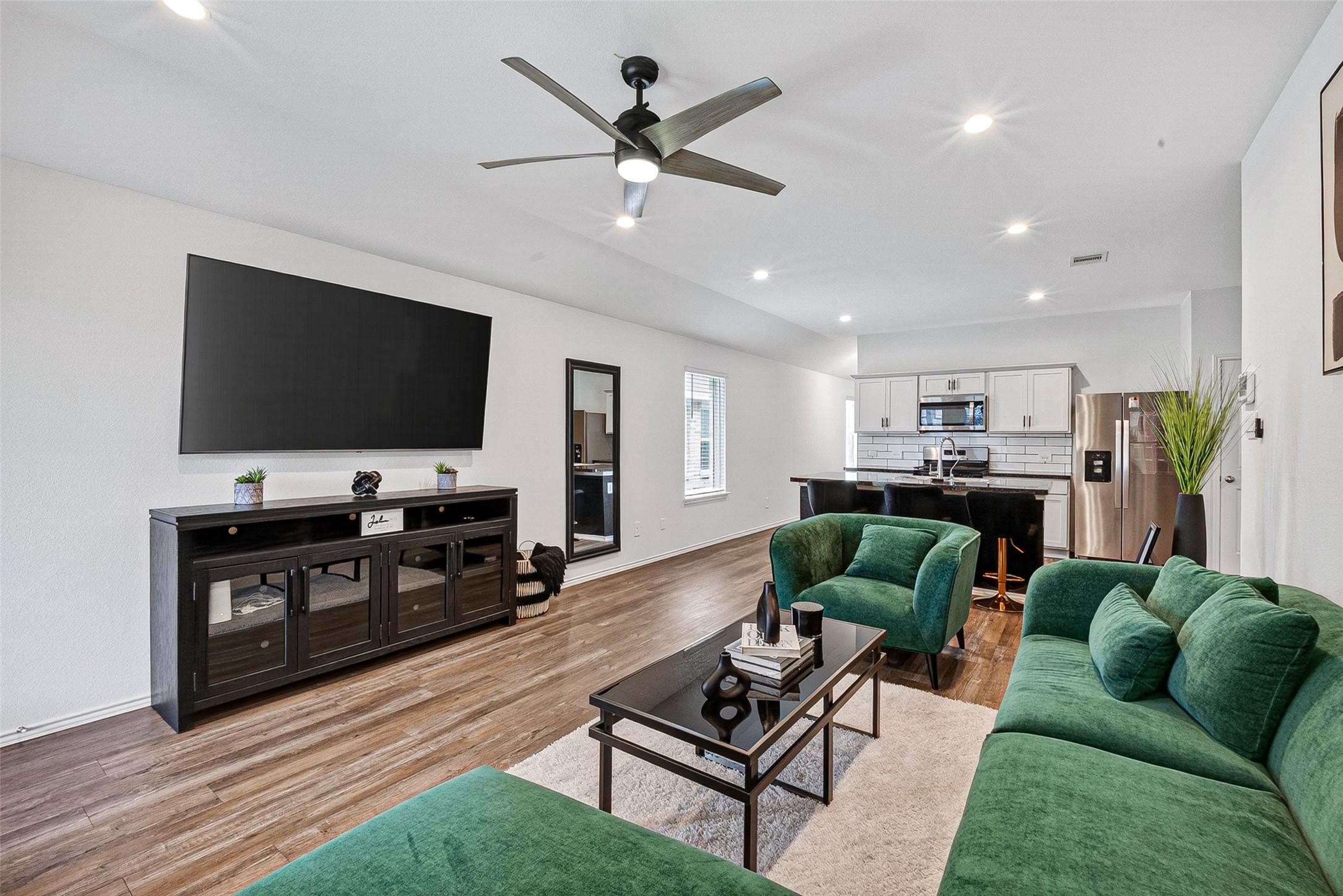 24318 Pebble Crescent Ln Spring Spring, TX 77373 - Photo 7 of 30 Spacious open-concept living room filled with abundant natural light, creating the perfect space for relaxing, entertaining, and gathering with family and friends.