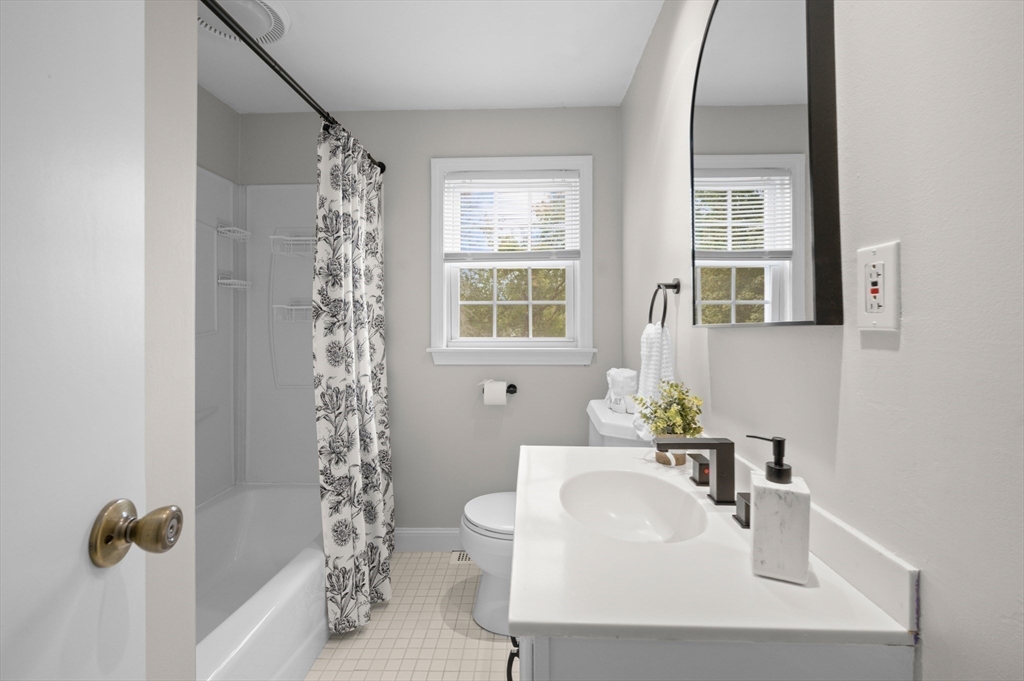 39 Wadsworth Street Danvers, MA 01923 - Photo 11 of 35 a bathroom with a sink toilet and tub