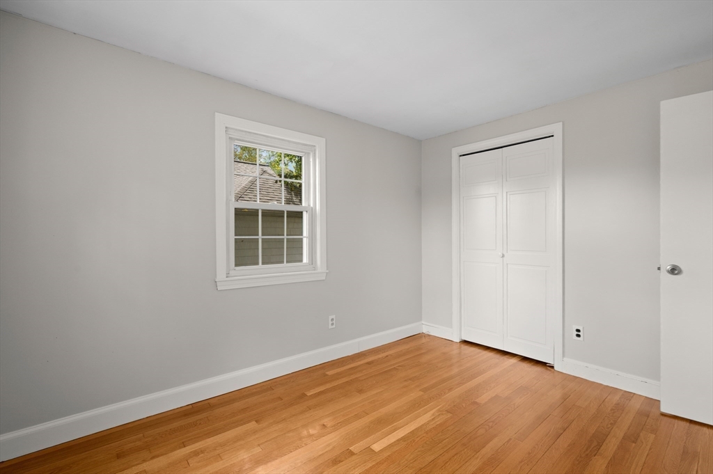 39 Wadsworth Street Danvers, MA 01923 - Photo 14 of 35 a view of empty room with wooden floor and fan