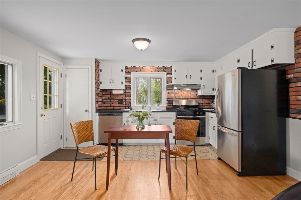 39 Wadsworth Street Danvers, MA 01923 - Photo 2 of 35 a kitchen with granite countertop a refrigerator and a stove top oven