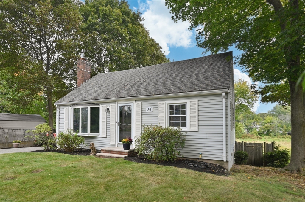 39 Wadsworth Street Danvers, MA 01923 - Photo 24 of 35 a house that has a tree in front of it