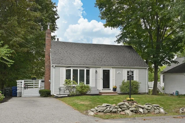 a view of a deck with chairs and a potted plant
