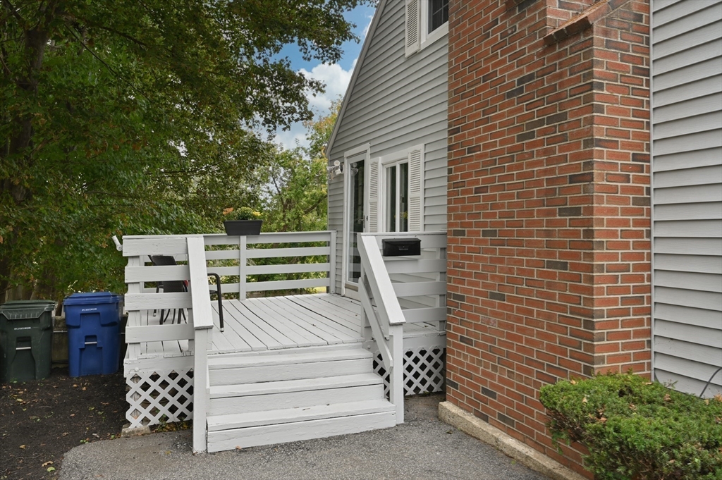 39 Wadsworth Street Danvers, MA 01923 - Photo 30 of 35 a view of a deck with chairs and a potted plant