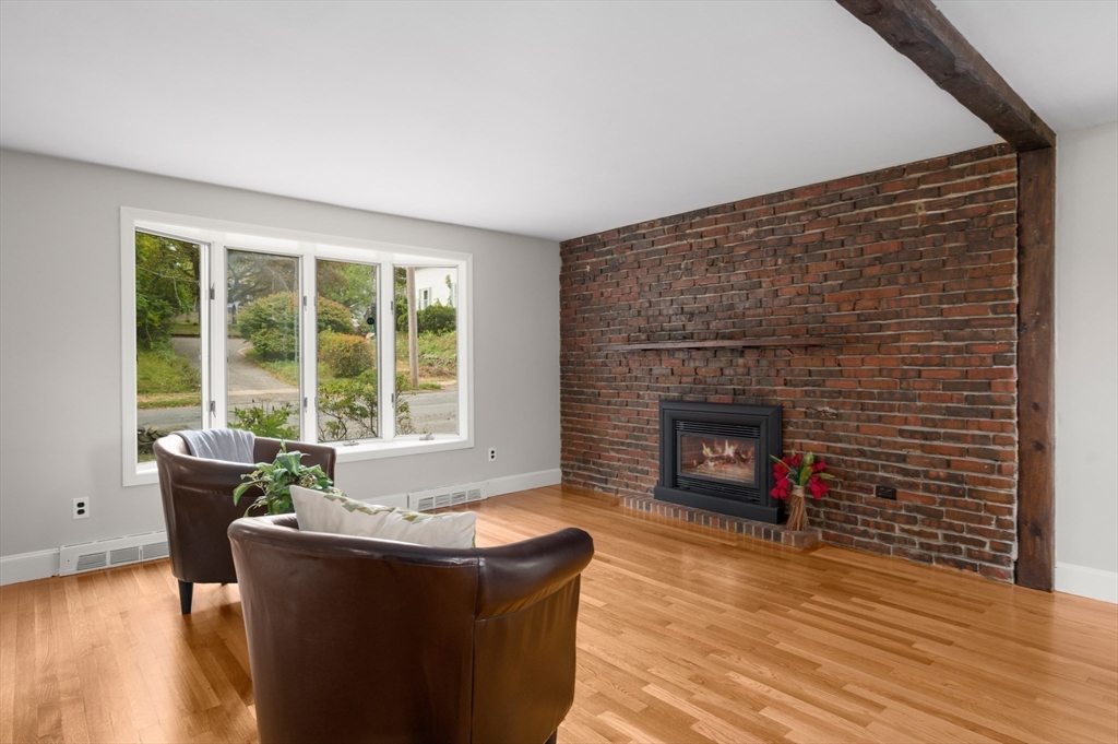 39 Wadsworth Street Danvers, MA 01923 - Photo 6 of 35 a living room with furniture and a fireplace