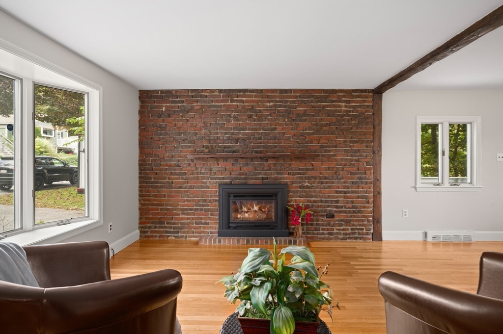 39 Wadsworth Street Danvers, MA 01923 - Photo 7 of 35 a living room with furniture and a fireplace