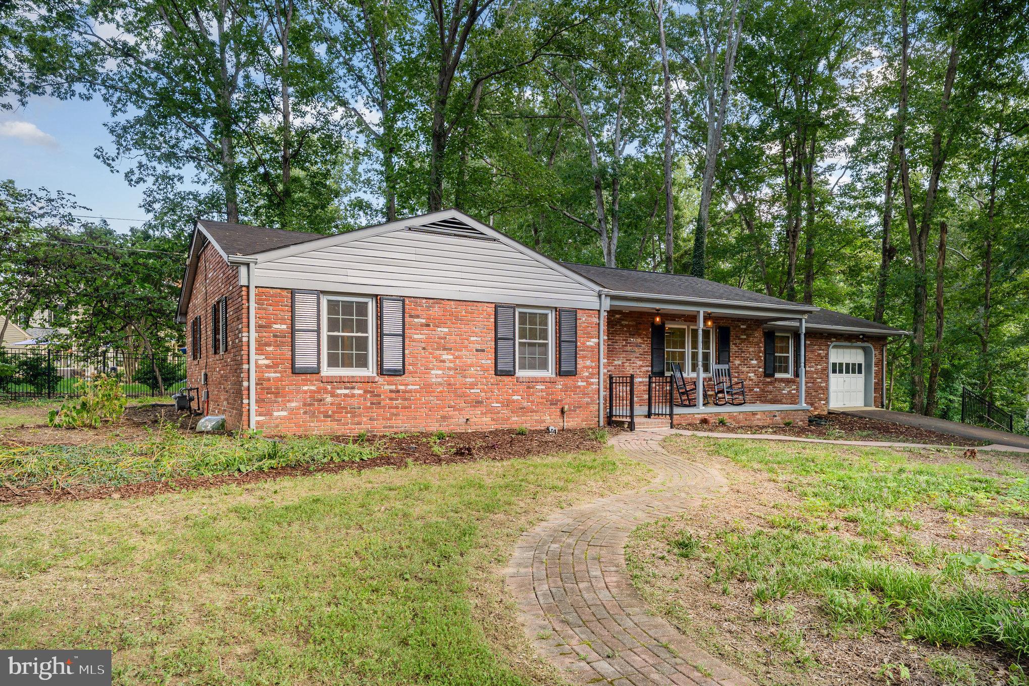 112 Jay Road Fredericksburg, VA 22405 - Photo 2 of 44 a front view of a house with a yard and trees