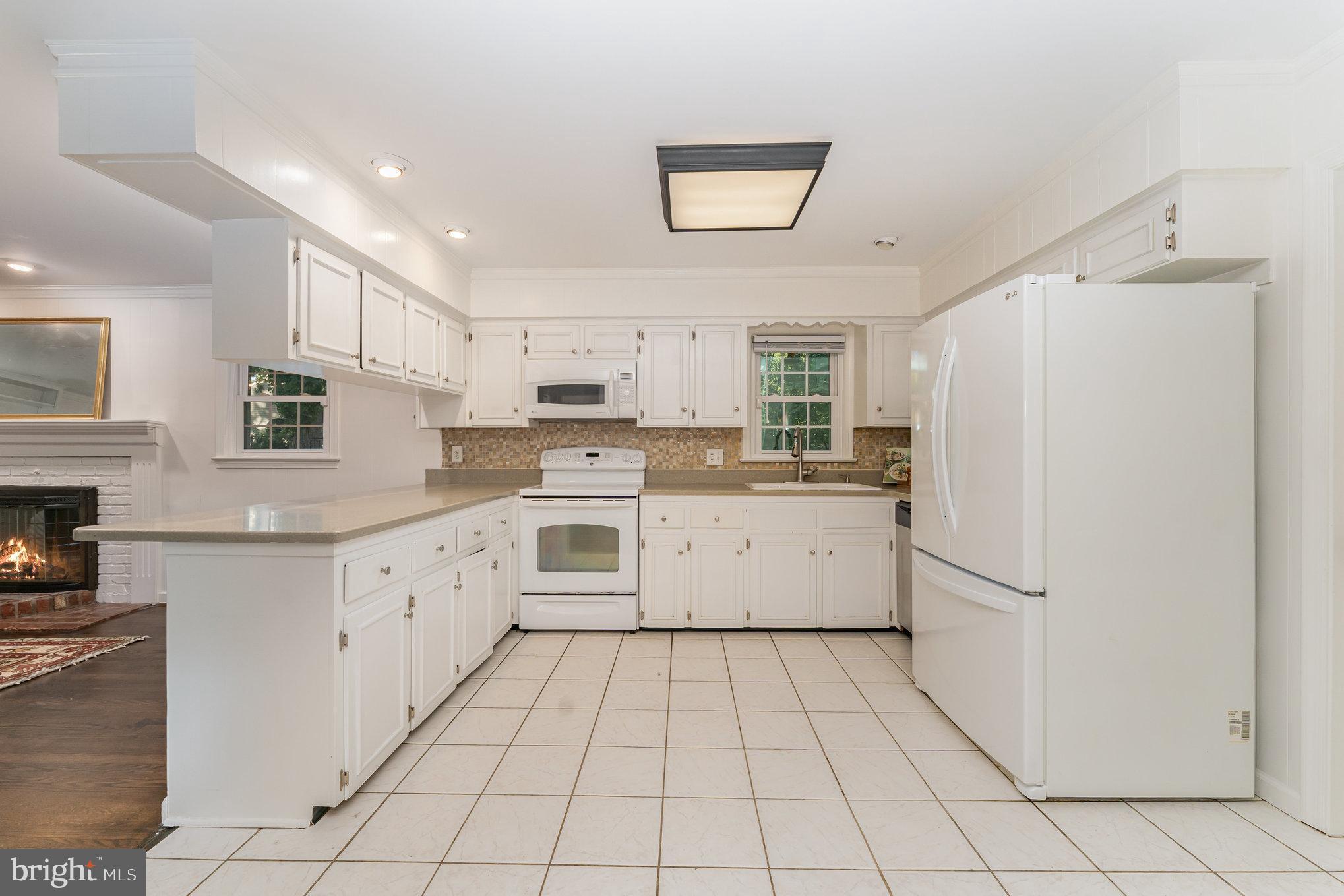 112 Jay Road Fredericksburg, VA 22405 - Photo 22 of 44 a kitchen with white cabinets a white refrigerator and a stove top oven
