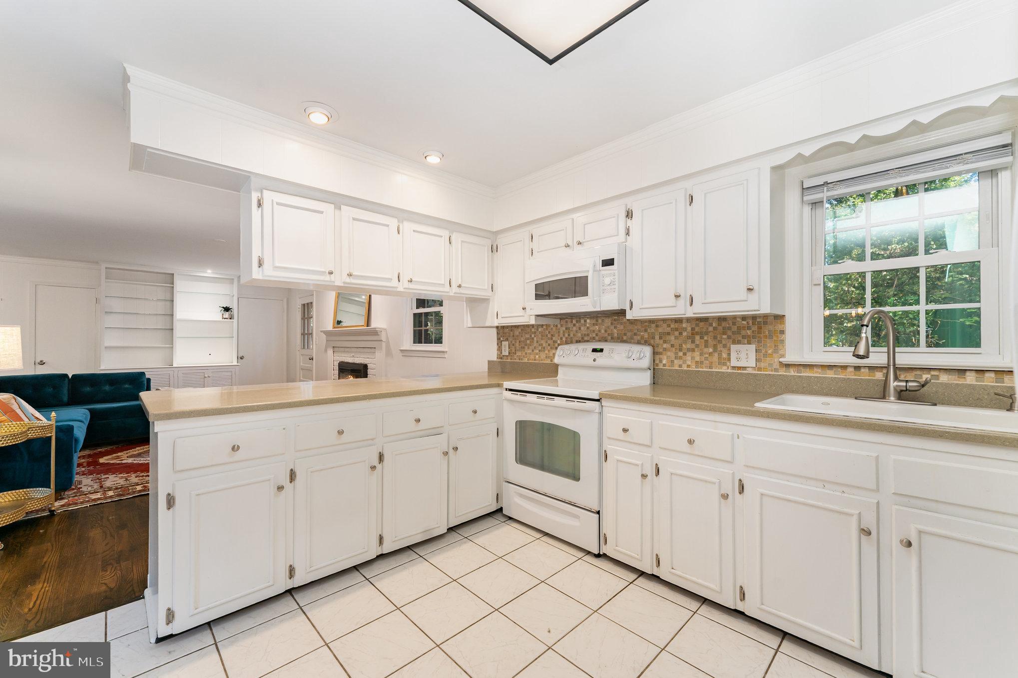 112 Jay Road Fredericksburg, VA 22405 - Photo 23 of 44 a kitchen with cabinets appliances a sink and a window