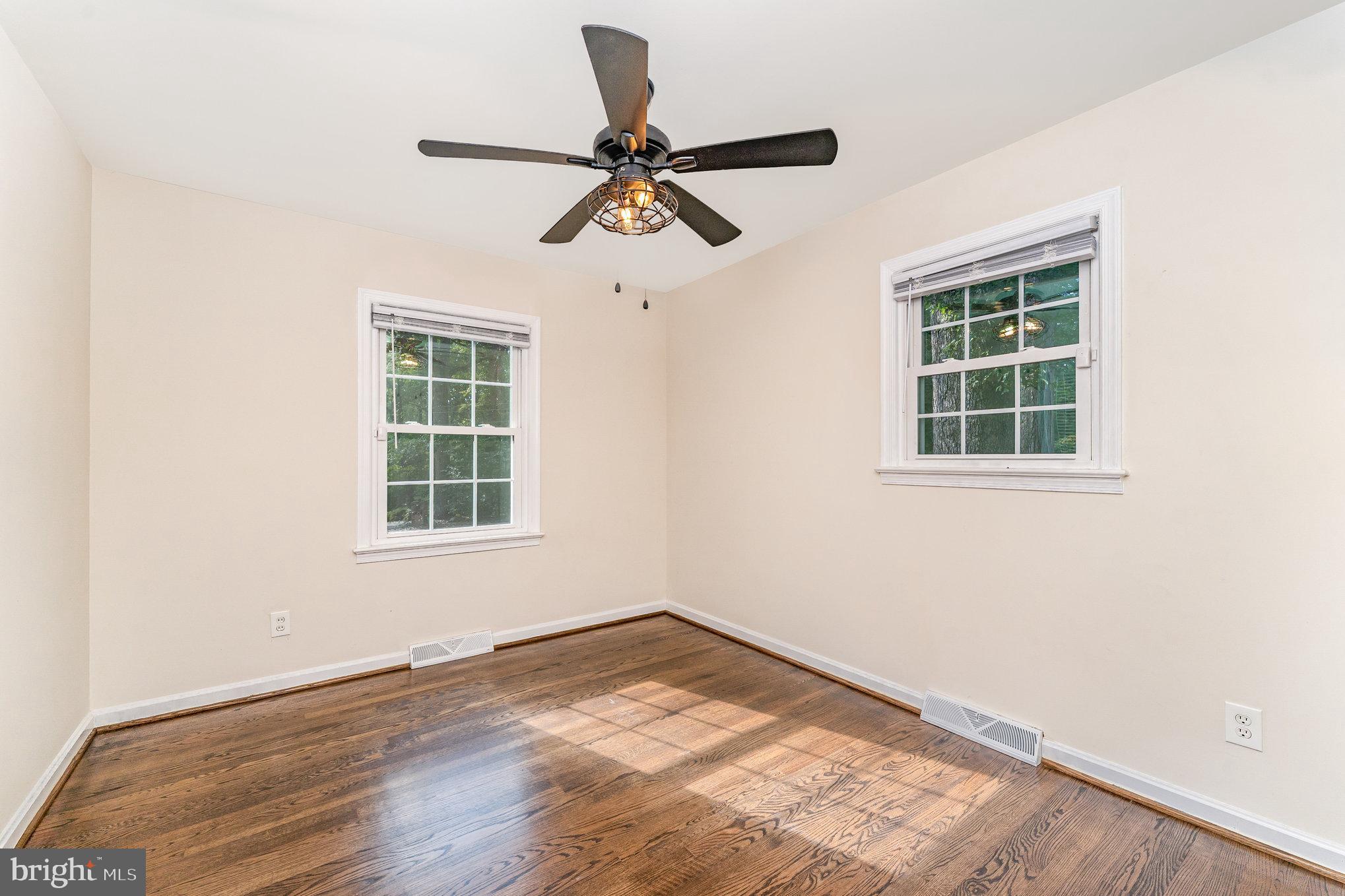 112 Jay Road Fredericksburg, VA 22405 - Photo 29 of 44 an empty room with wooden floor fan and windows