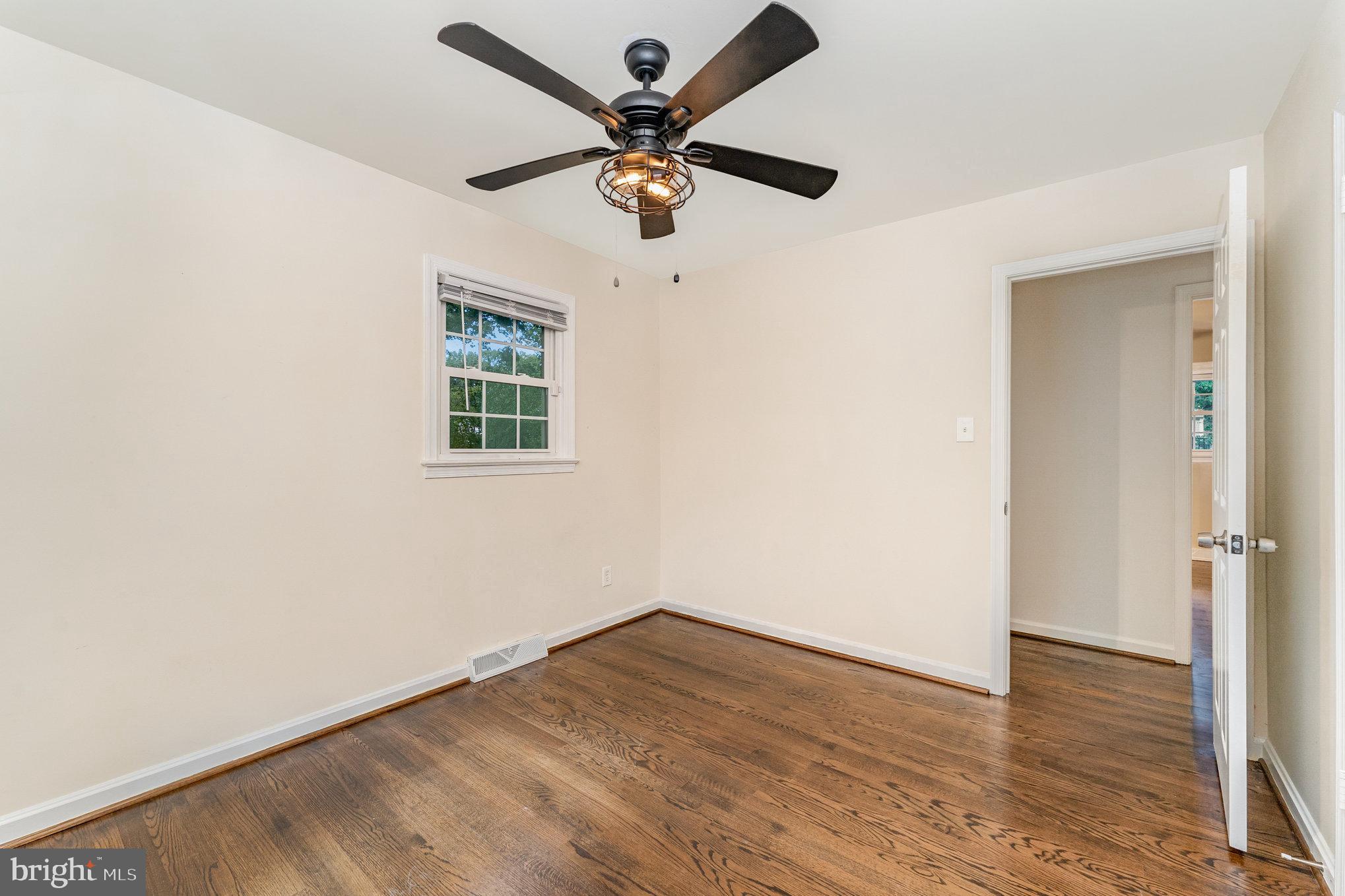 112 Jay Road Fredericksburg, VA 22405 - Photo 30 of 44 an empty room with wooden floor and ceiling fan