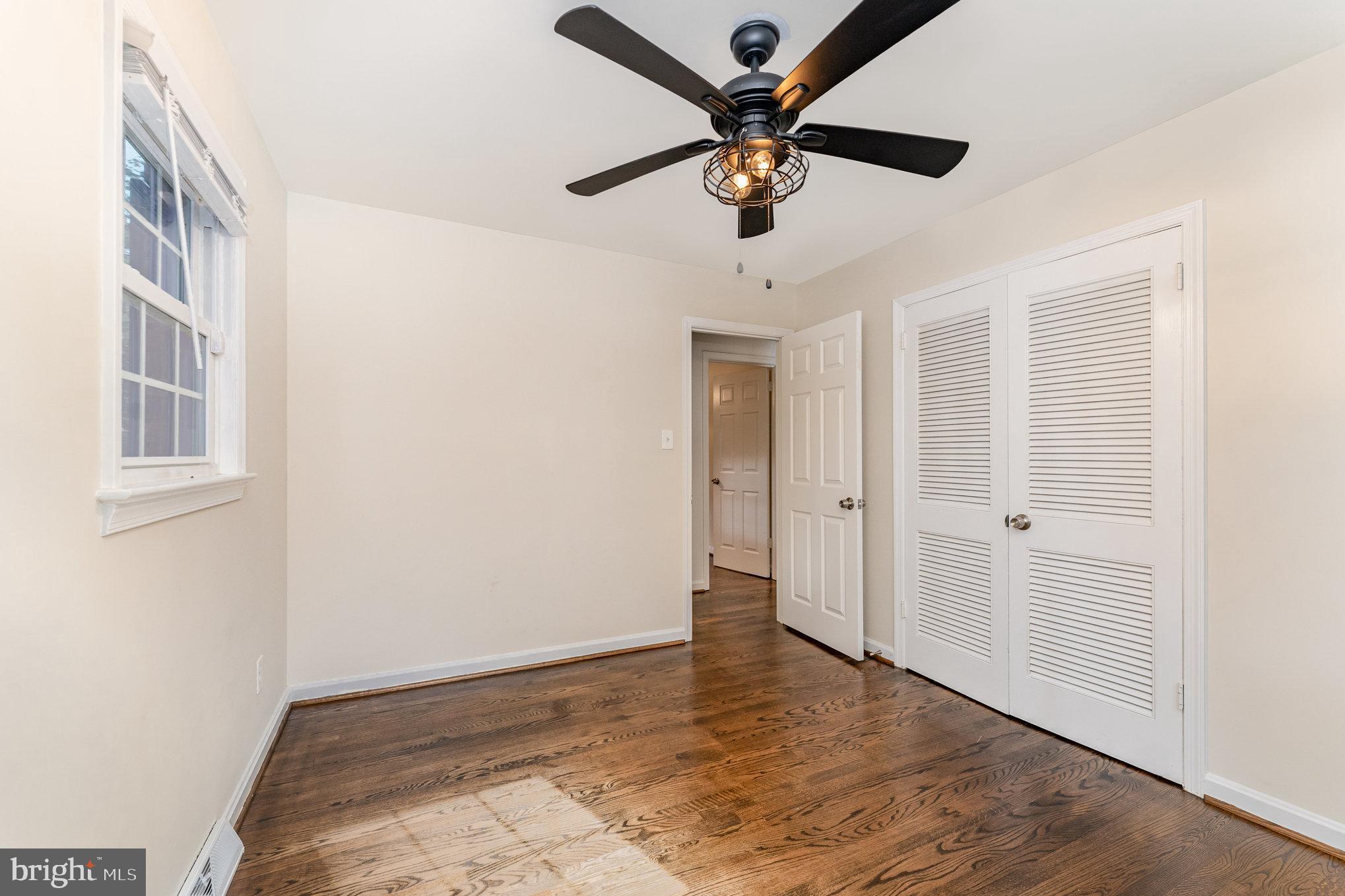 112 Jay Road Fredericksburg, VA 22405 - Photo 33 of 44 an empty room with wooden floor and ceiling fan