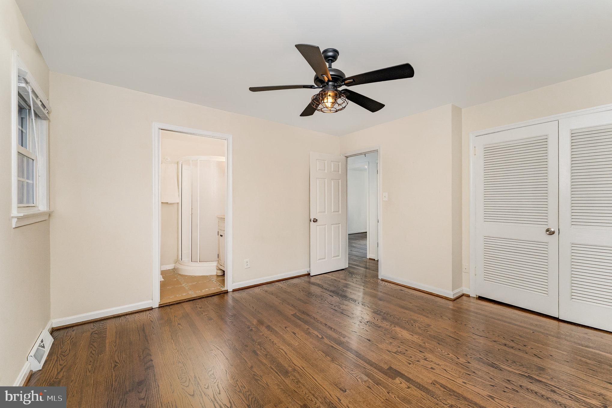 112 Jay Road Fredericksburg, VA 22405 - Photo 35 of 44 an empty room with wooden floor and windows