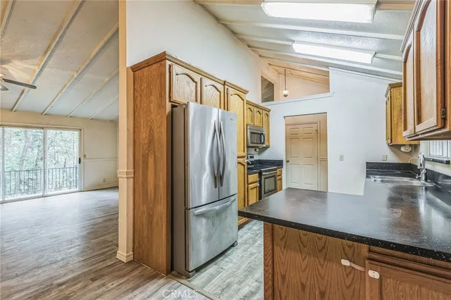 a view of kitchen with wooden floor