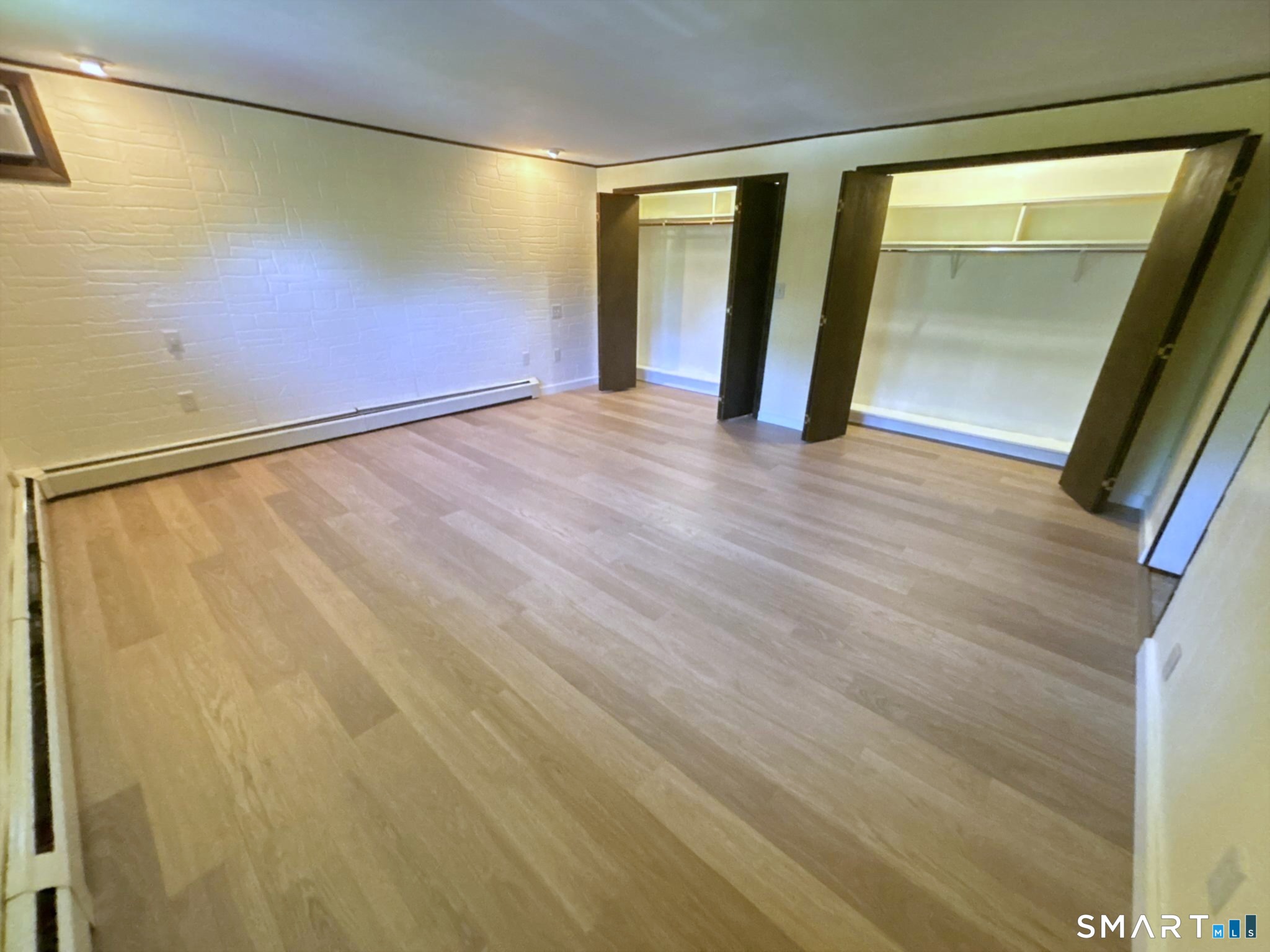 44 Summit Road Prospect, CT 06712 - Photo 19 of 40 a view of an empty room with wooden floor and a window