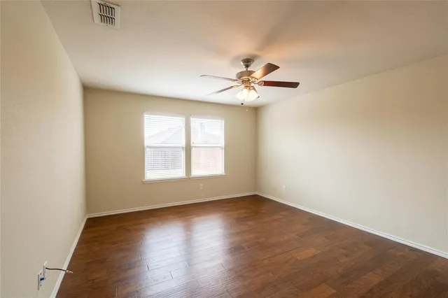 a view of kitchen with cabinets microwave and stove