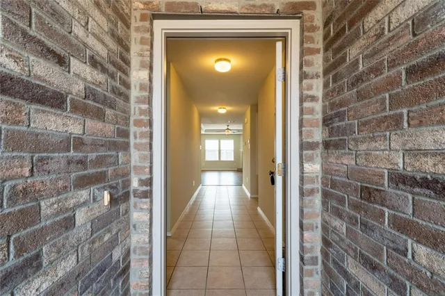 a view of a hallway with a door