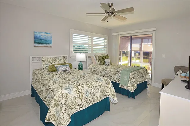 a bedroom with bed and window