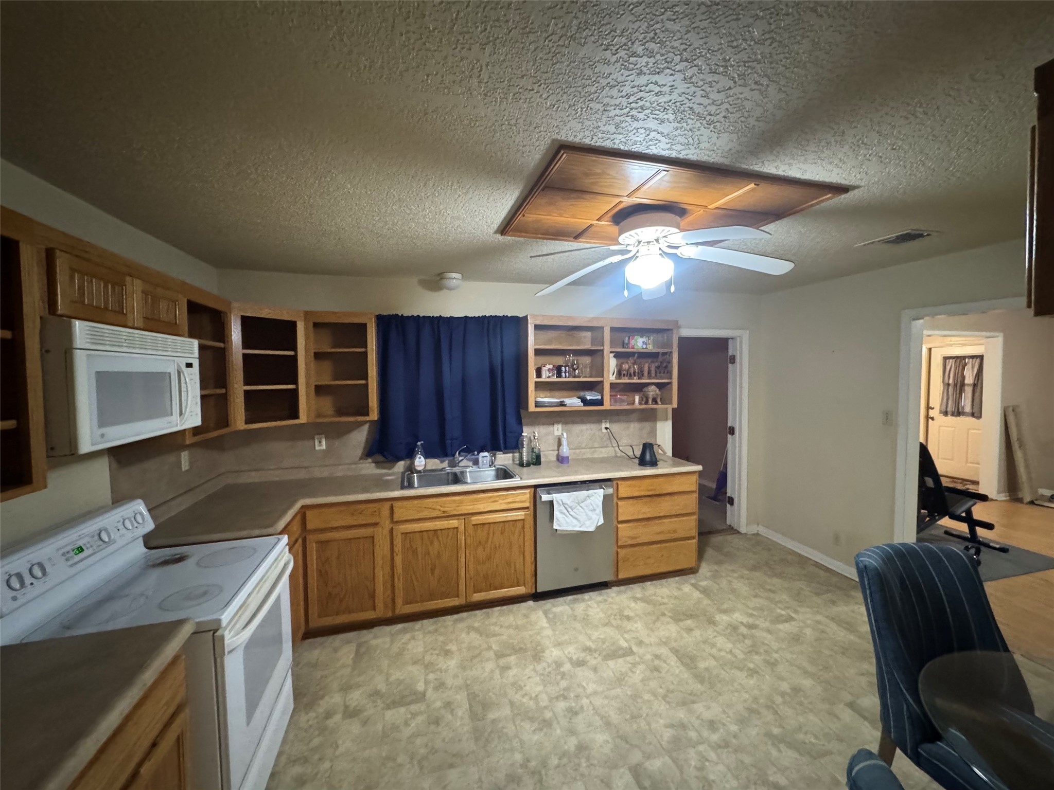 307 5th Street Sutherland Springs, TX 78161 - Photo 12 of 16 a kitchen with a stove a sink and a refrigerator