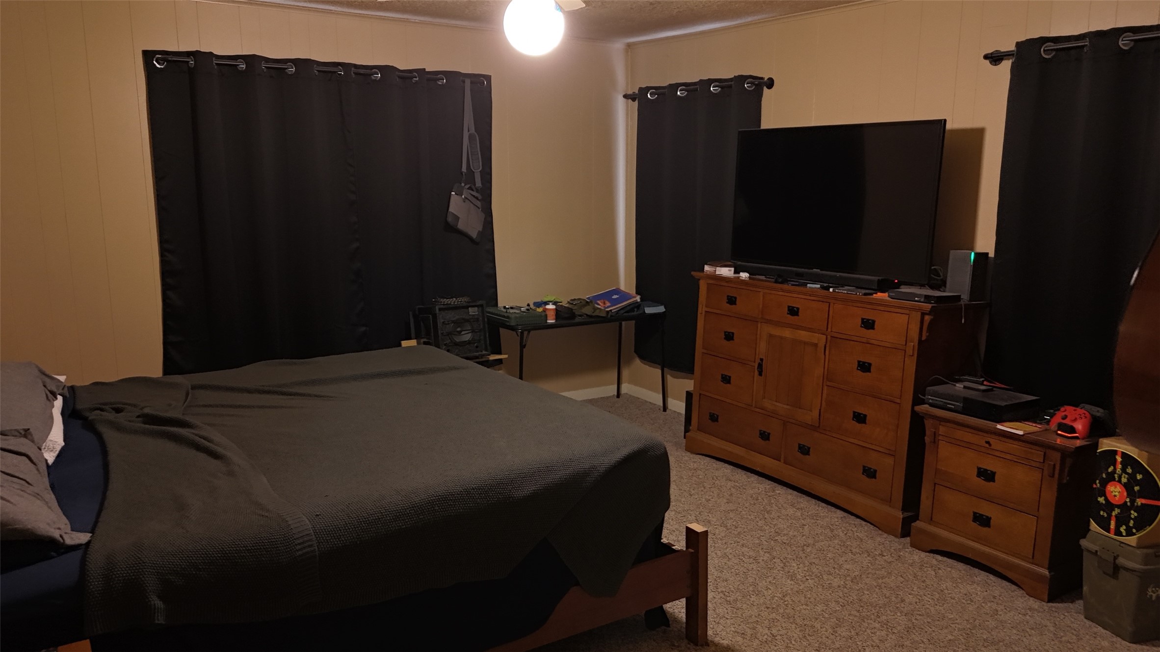 307 5th Street Sutherland Springs, TX 78161 - Photo 14 of 16 a bedroom with a bed and a flat tv screen on dresser
